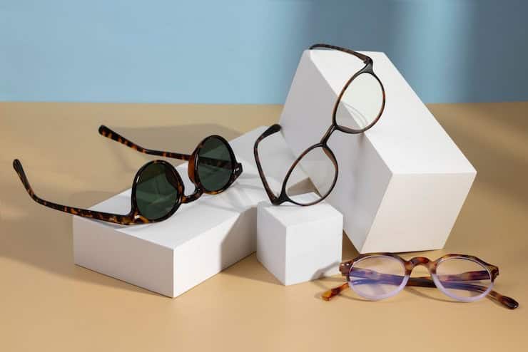 Stylish eyeglasses displayed on white geometric blocks