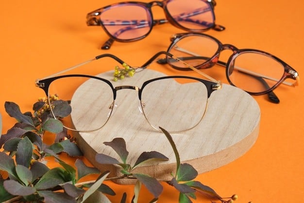 Three stylish eyeglasses on wooden display with greenery